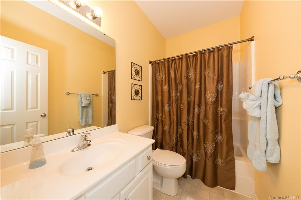 607 Caspar Way Fort Mill, SC 29708 - Photo 14 of 24 a bathroom with a sink a toilet and shower
