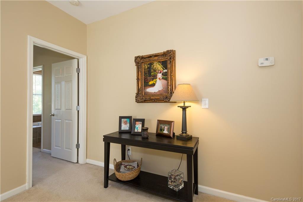 607 Caspar Way Fort Mill, SC 29708 - Photo 15 of 24 a room with a table and a lamp