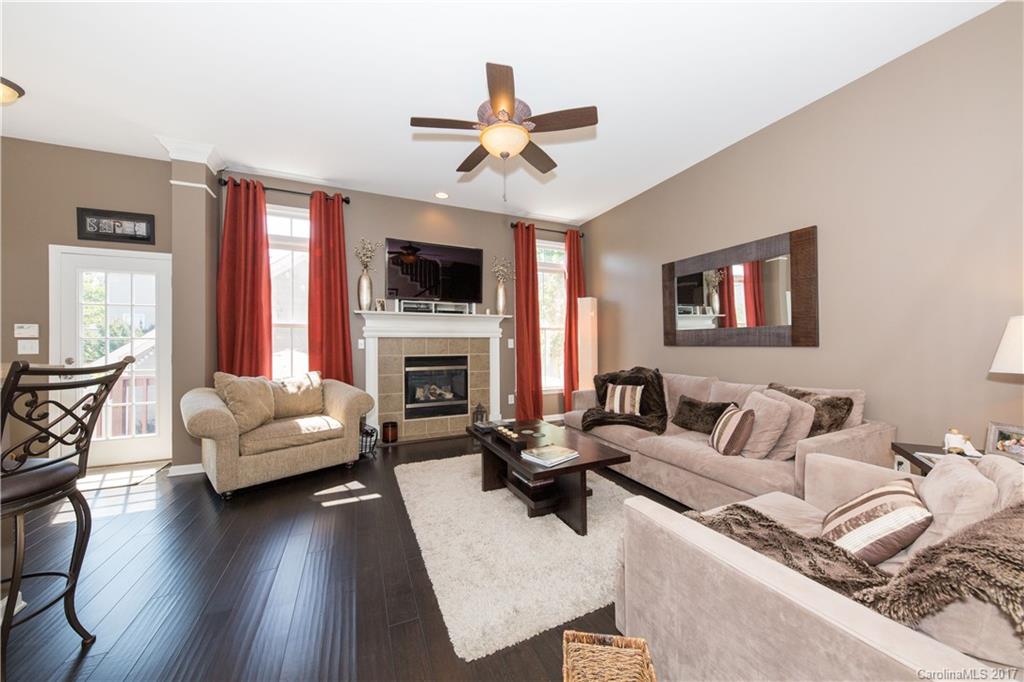 607 Caspar Way Fort Mill, SC 29708 - Photo 6 of 24 a living room with furniture fireplace and a flat screen tv