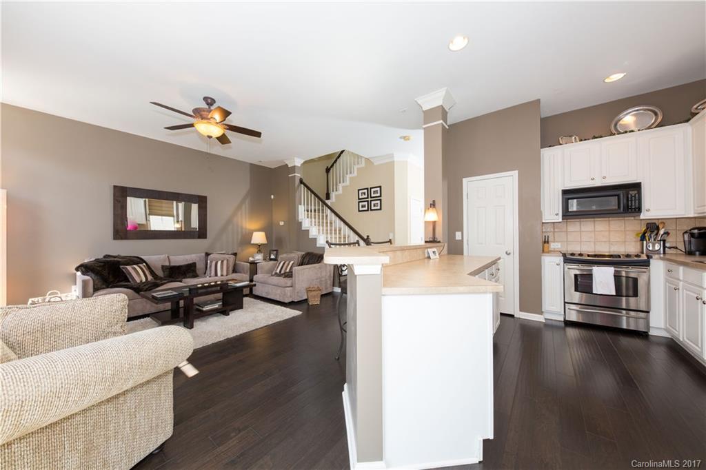 607 Caspar Way Fort Mill, SC 29708 - Photo 7 of 24 a living room with fireplace furniture and a wooden floor