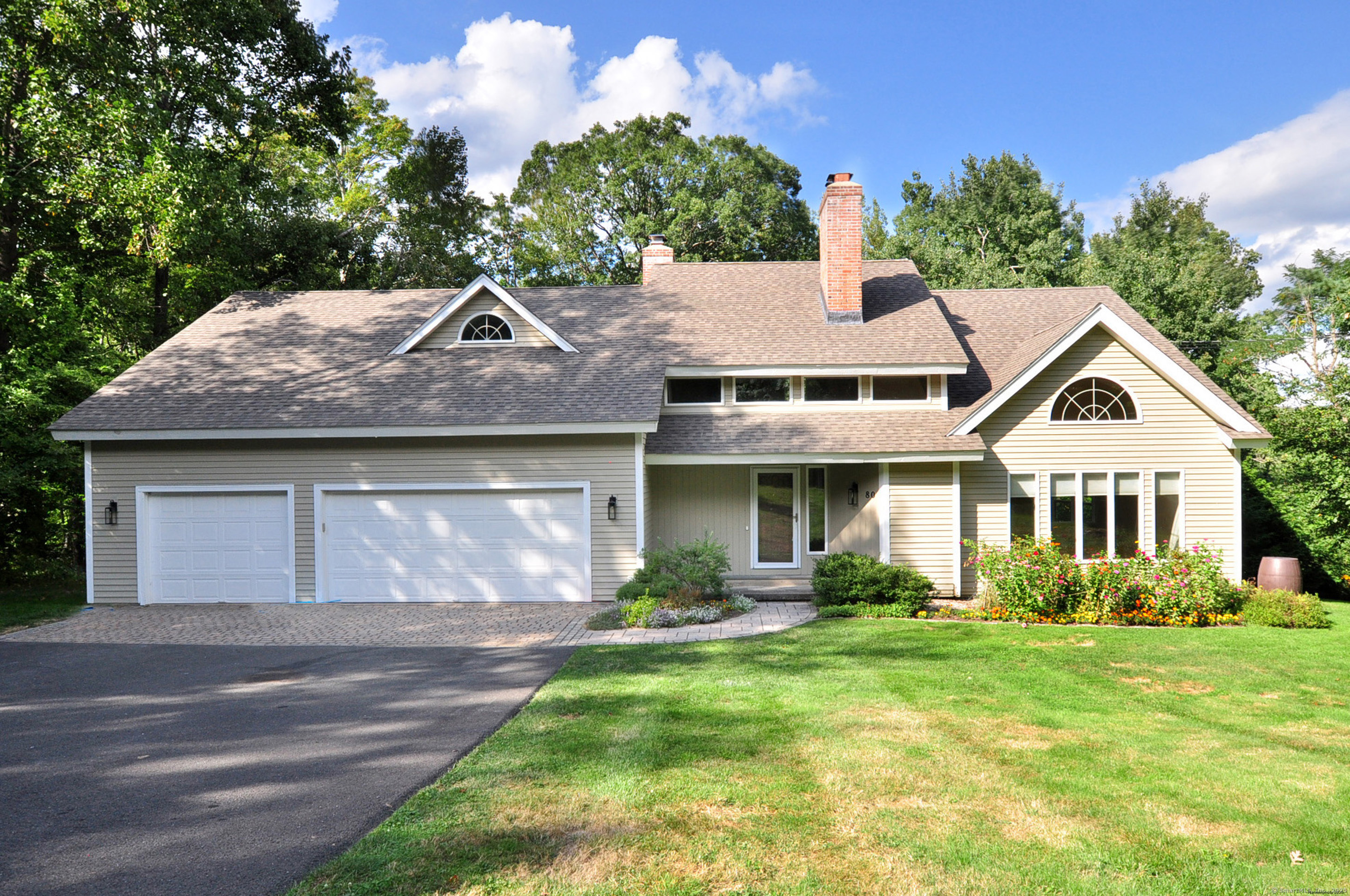 80 Mountain Road Granby, CT 06060 - Photo 1 of 1 a front view of a house with garden