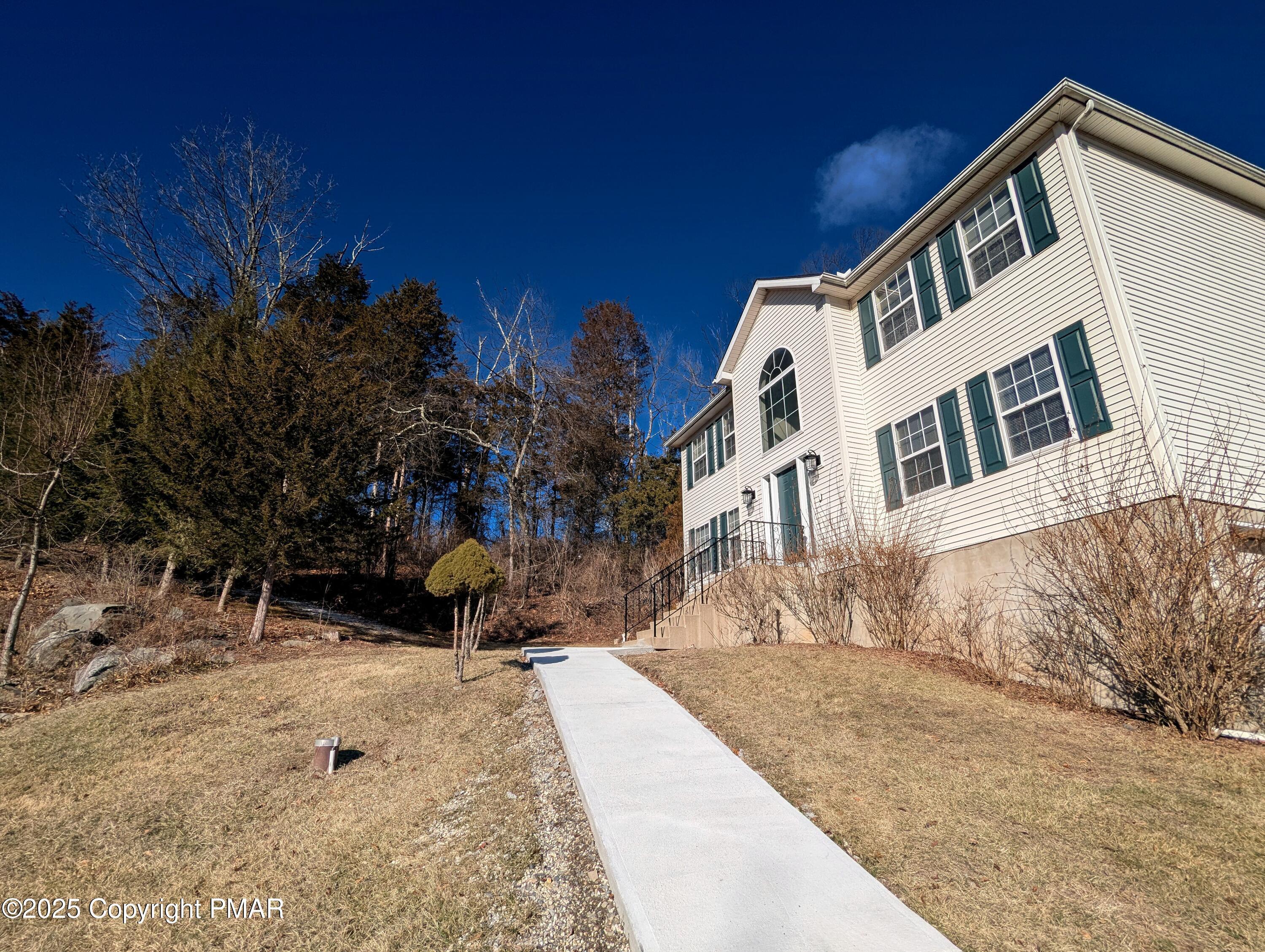 1603 Rachel Road Stroudsburg, PA 18360 - Photo 2 of 33 a view of a white house with a yard