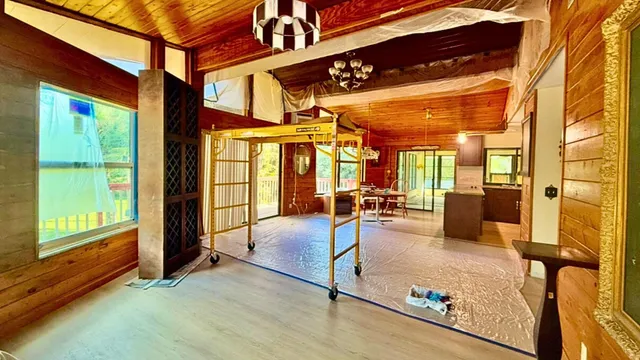 a view of a living room with a large window