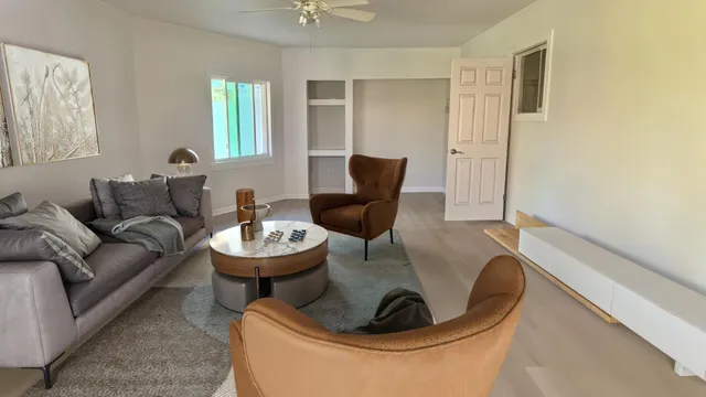 a living room with furniture and a window