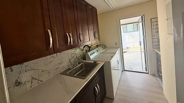 a kitchen with a stove and a refrigerator