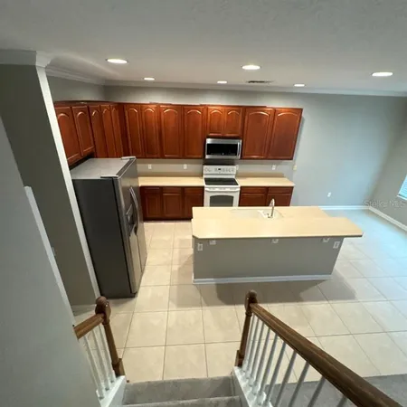 a room with wooden floor and furniture