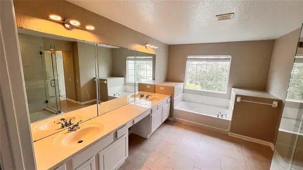 a bathroom with a shower and a sink