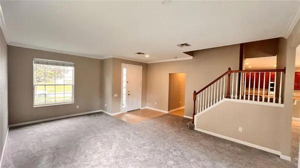 a view of an empty room with a window
