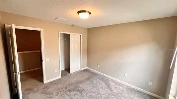 a bathroom with a sink and mirror with toilet