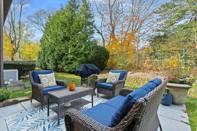 a view of a patio with couple of chairs