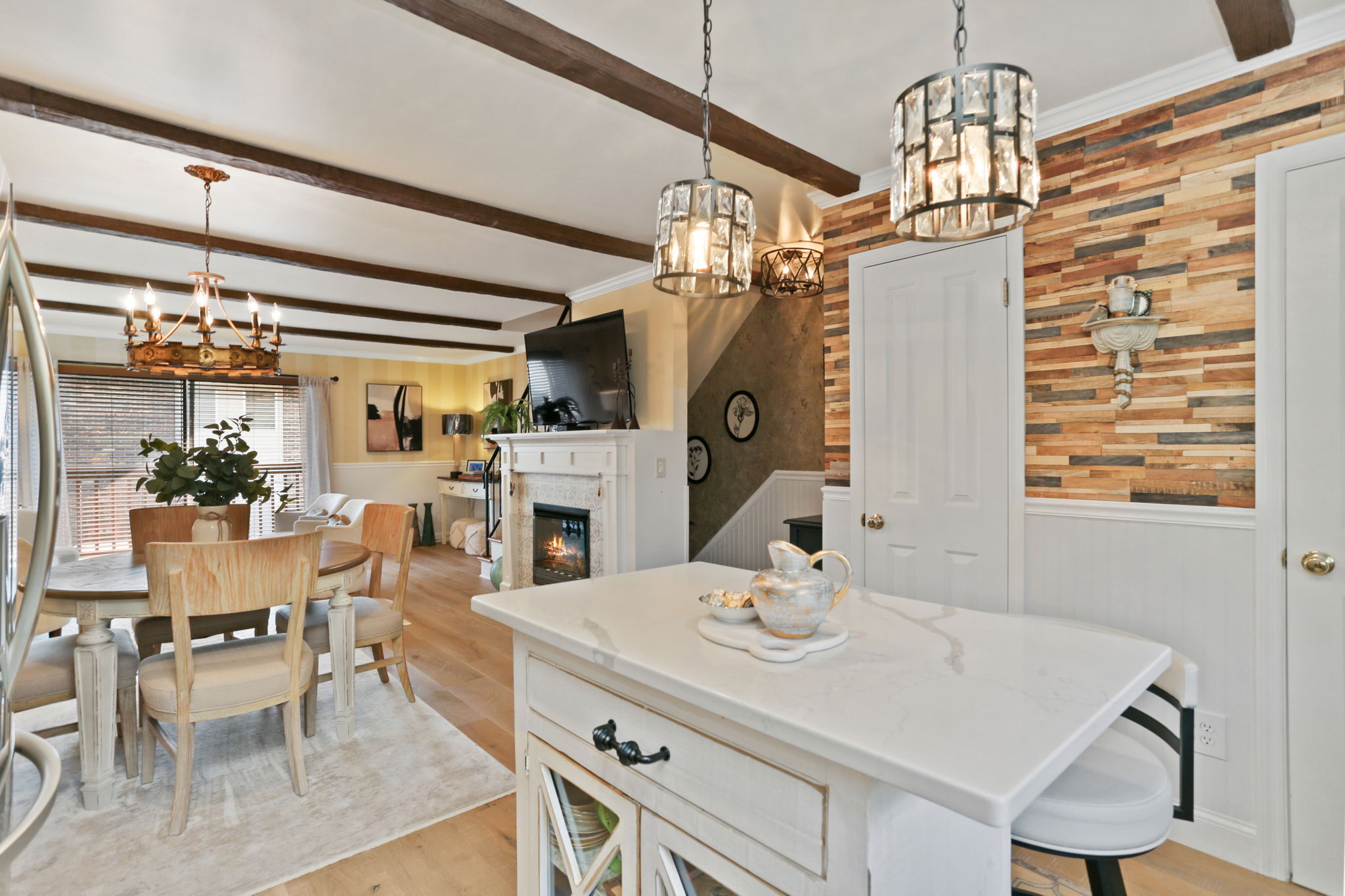 376 Knapps Highway, Unit 376 Fairfield, CT 06825 - Photo 4 of 22 a view of a dining room with furniture and a chandelier