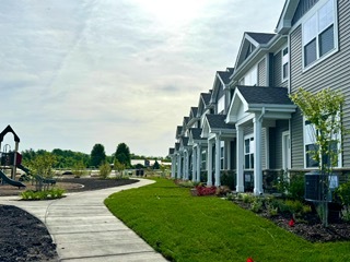 2136 Bodega Road, Unit 2136 Oswego, IL 60543 - Photo 5 of 19 a view of a building with a yard