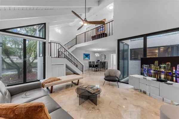 a living room with furniture and a large window
