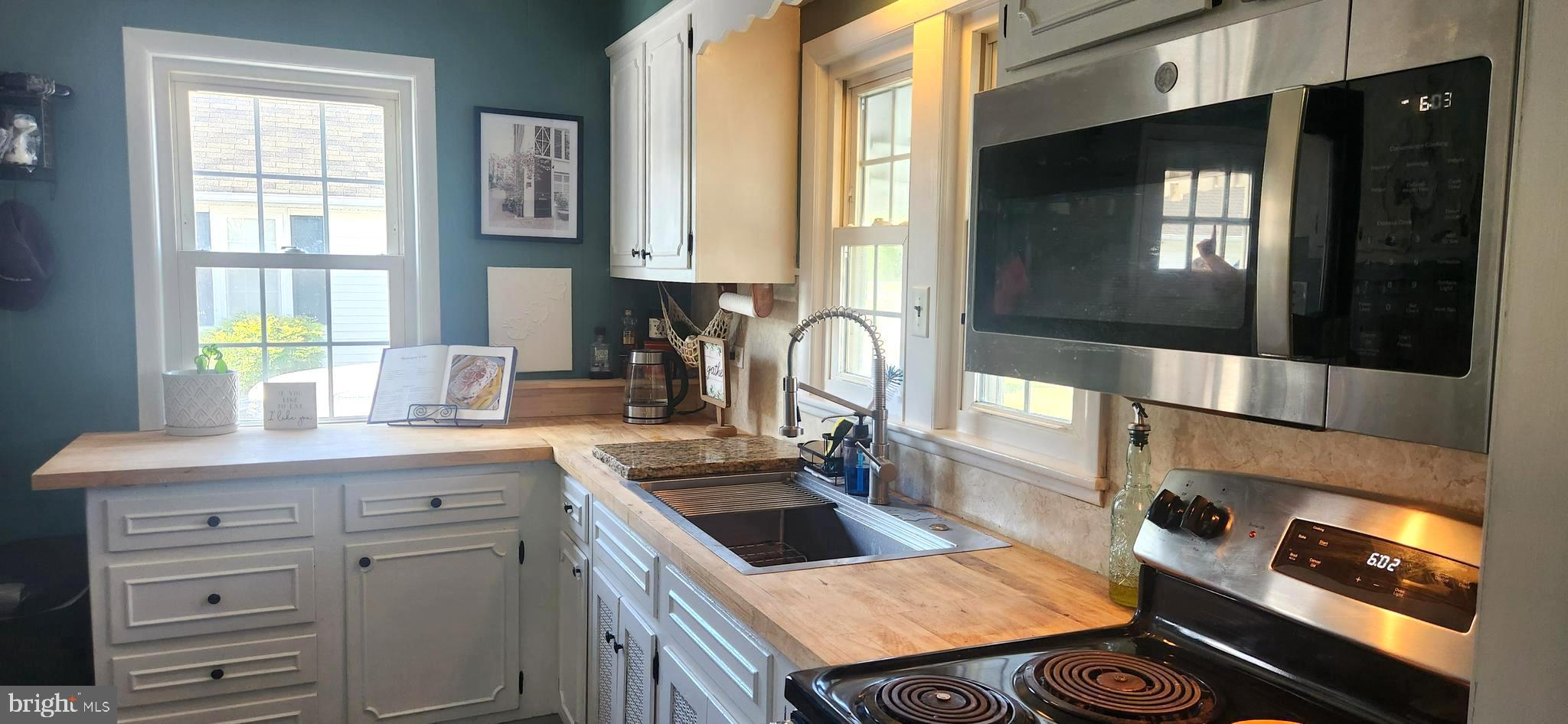 2001 Rhodesdale Vienna Vienna, MD 21869 - Photo 20 of 39 a kitchen with a sink stove and cabinets