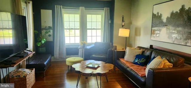 a living room with furniture and a window
