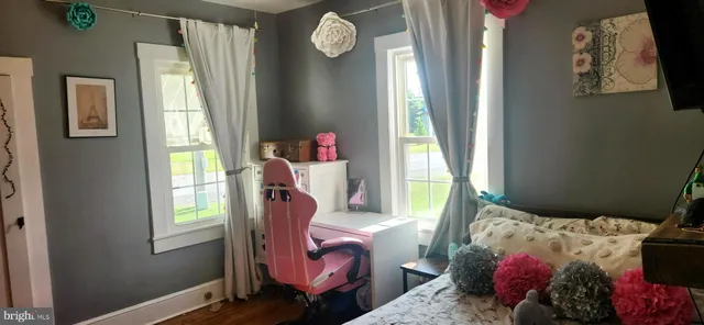 a bed room with a bed and a window