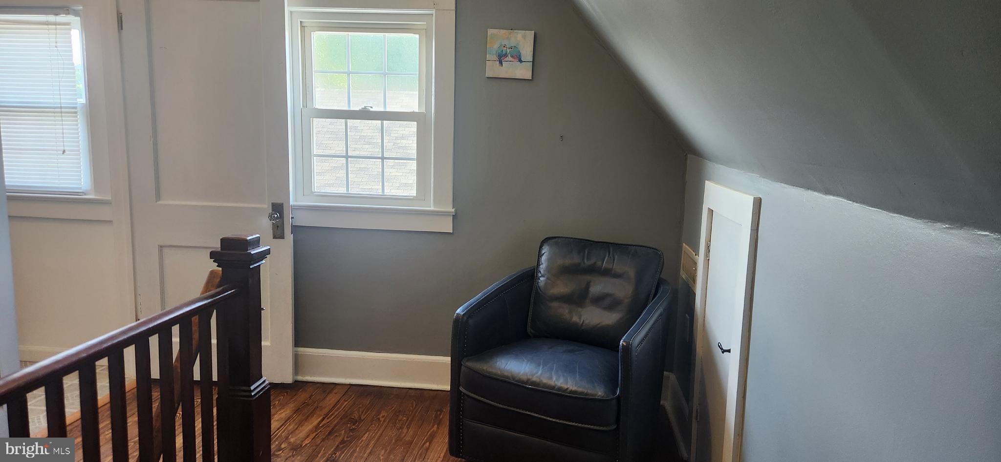 2001 Rhodesdale Vienna Vienna, MD 21869 - Photo 32 of 39 a view of a hallway with wooden floor and a workspace