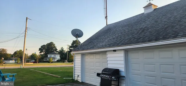 a view of a backyard with sitting area
