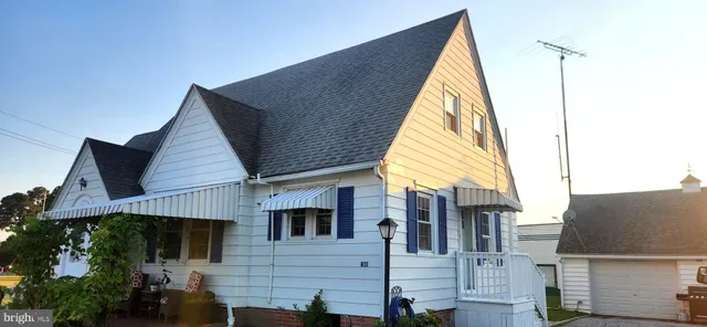 a view of a house with a street