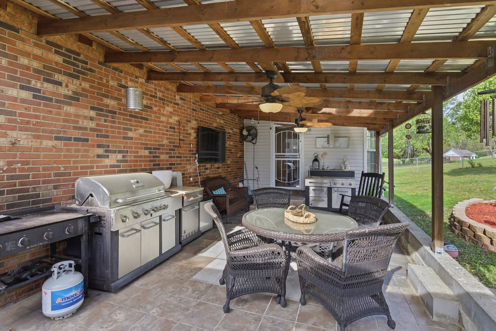 1140 Campbell Road Goodlettsville, TN 37072 - Photo 28 of 33 a dining room with furniture a rug and a grill
