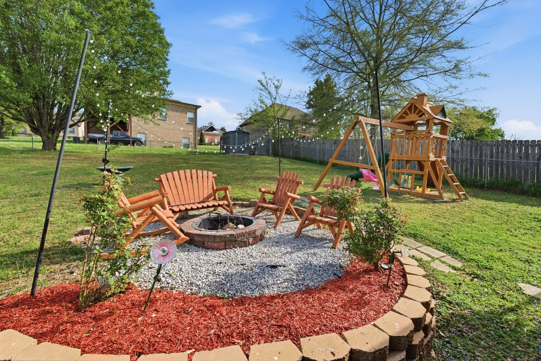 1140 Campbell Road Goodlettsville, TN 37072 - Photo 29 of 33 a view of a backyard with plants and slide
