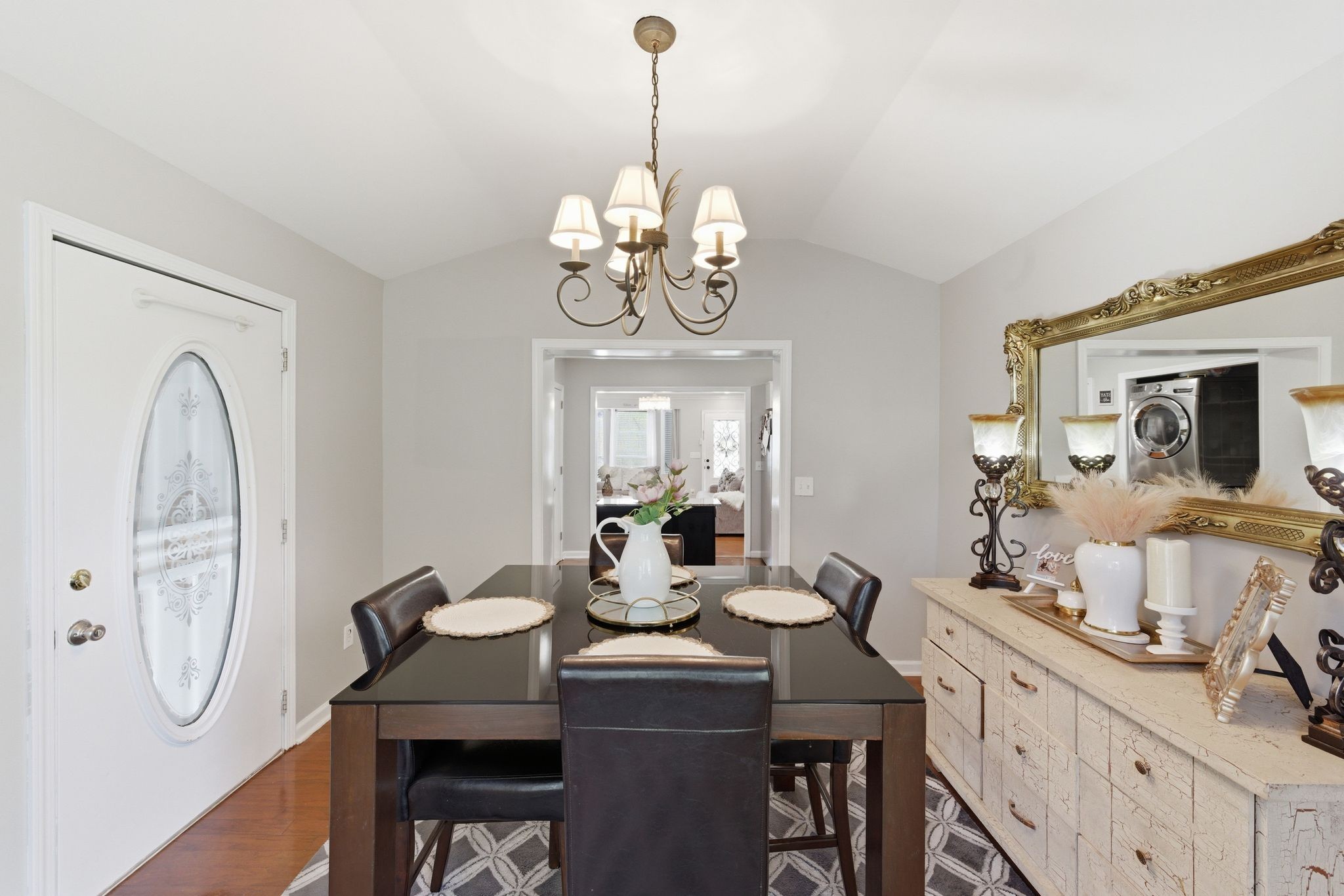1140 Campbell Road Goodlettsville, TN 37072 - Photo 10 of 33 a dining room with wooden floor a chandelier a wooden table and chairs