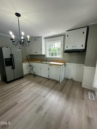 a room with furniture and wooden floor