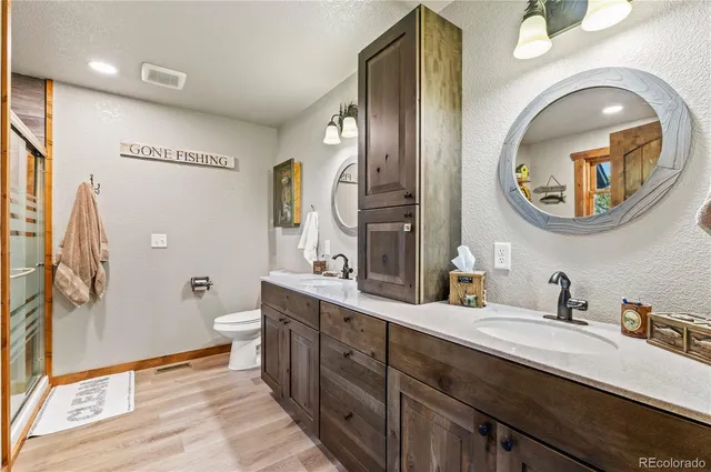 a bathroom with a tub sink and mirror
