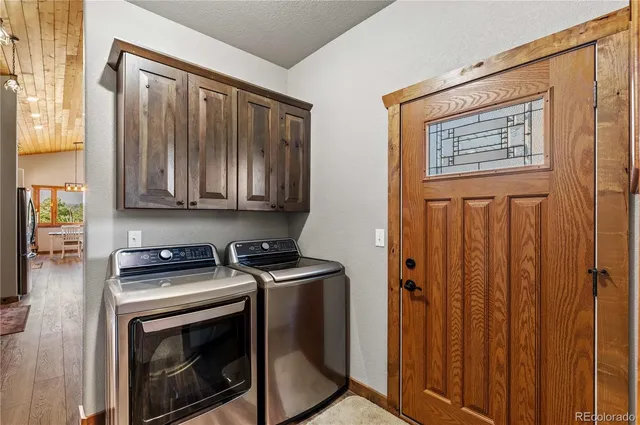 a view of a balcony with wooden floor and fence