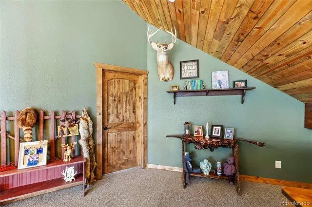 a bedroom with a bed and a table in it