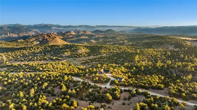 a view of a city with mountains in the background