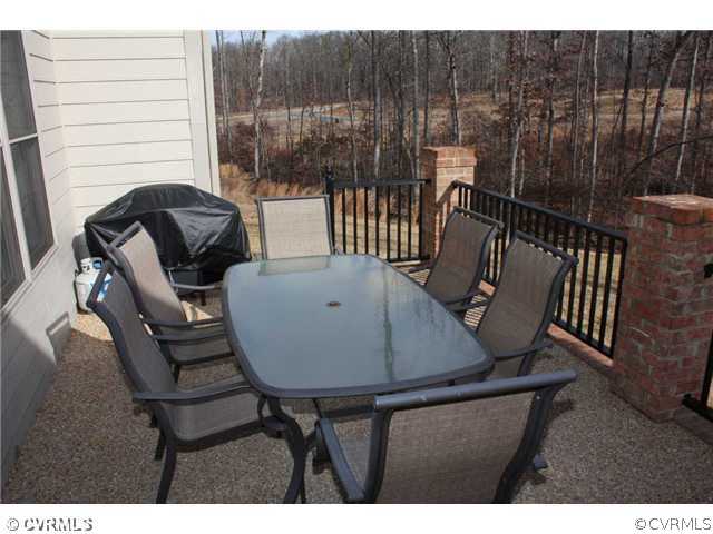 4018 Bircham Loop Midlothian, VA 23113 - Photo 11 of 12 a view of balcony with table and chairs