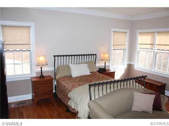 4018 Bircham Loop Midlothian, VA 23113 - Photo 7 of 12 a bedroom with a bed and a window