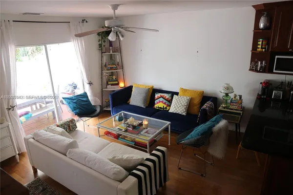 a living room with furniture and a window