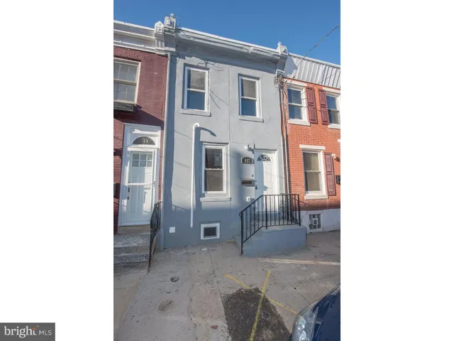 a backyard of a house with outdoor seating