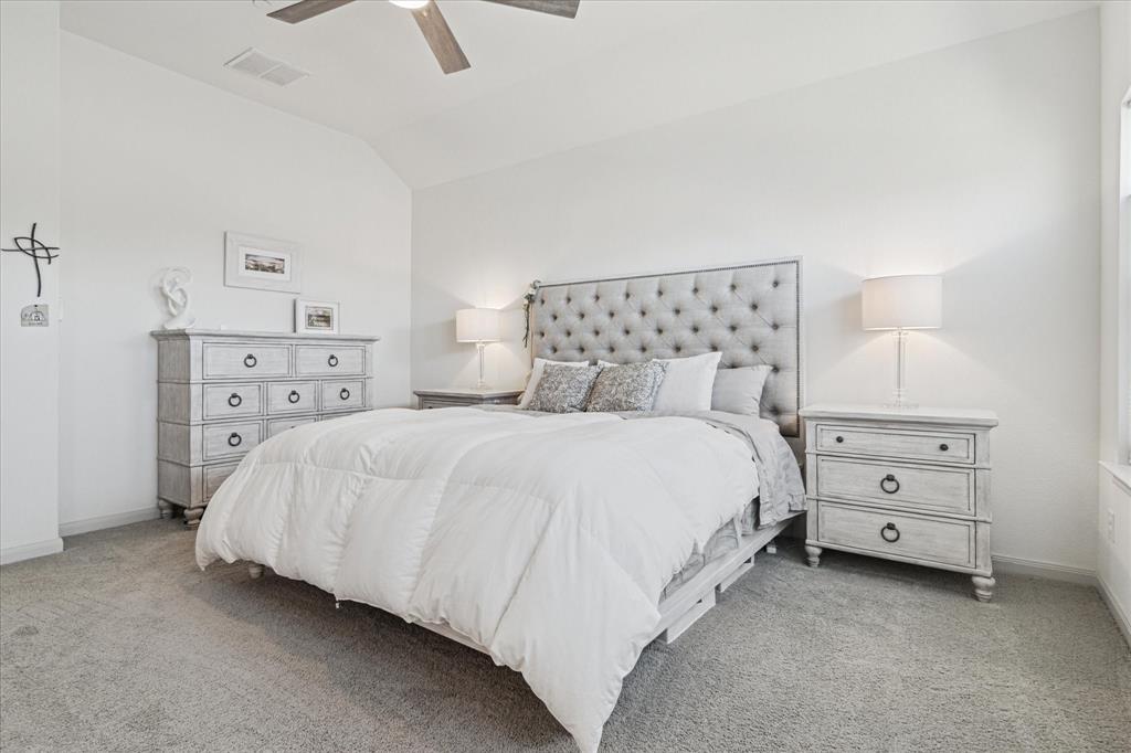 7919 Canal Street Frisco, TX 75034 - Photo 20 of 36 a bed room with a bed and a night stand