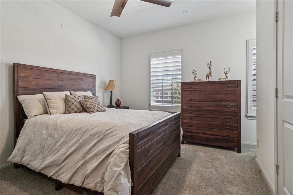 7919 Canal Street Frisco, TX 75034 - Photo 24 of 36 a bedroom with a bed and a dresser