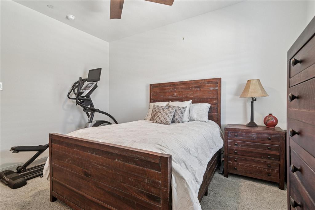 7919 Canal Street Frisco, TX 75034 - Photo 25 of 36 a bedroom with a bed and a dresser