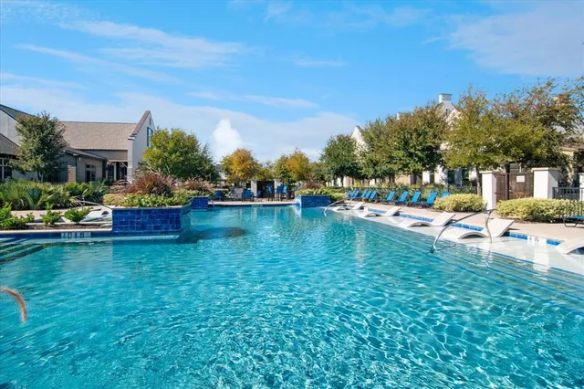 a swimming pool view with a lake view
