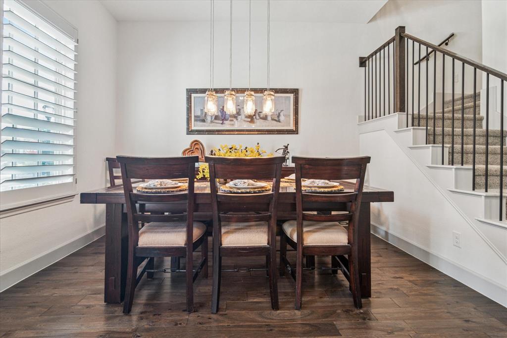 7919 Canal Street Frisco, TX 75034 - Photo 4 of 36 a view of a dining room with furniture and wooden floor