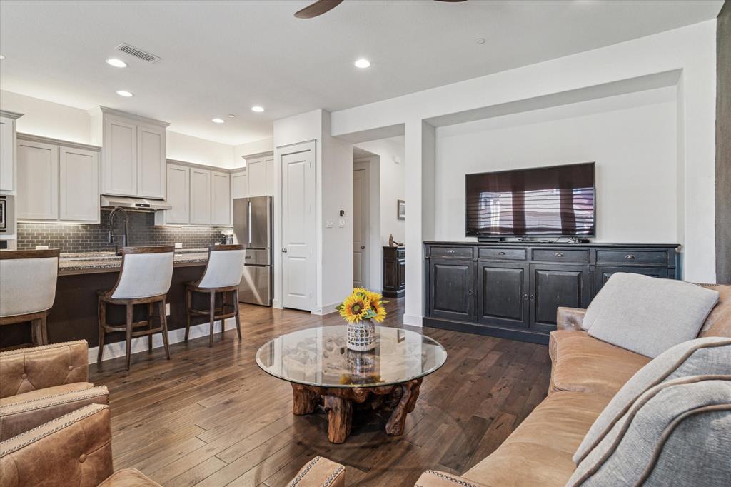 7919 Canal Street Frisco, TX 75034 - Photo 9 of 36 a living room with furniture and a dining table with kitchen view