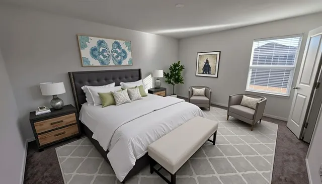 a bedroom with a bed a couch and a window