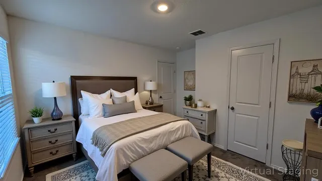a bedroom with a bed and furniture