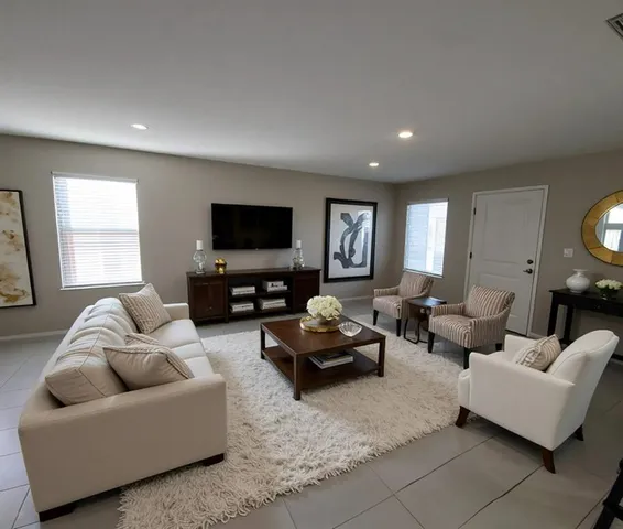 a living room with furniture and a flat screen tv