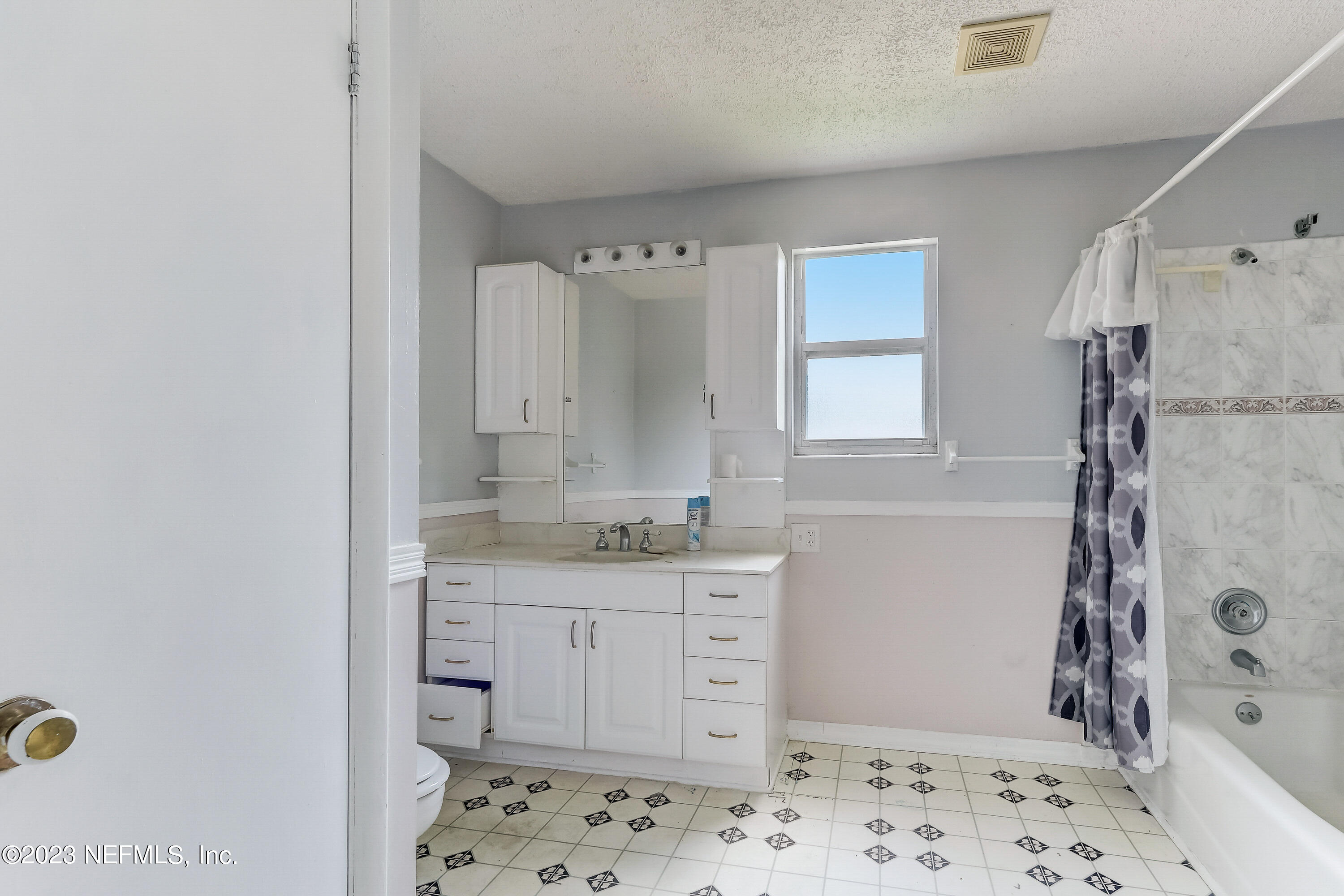 3547 Capper Road Jacksonville, FL 32218 - Photo 11 of 24 a bathroom with a sink a toilet and shower