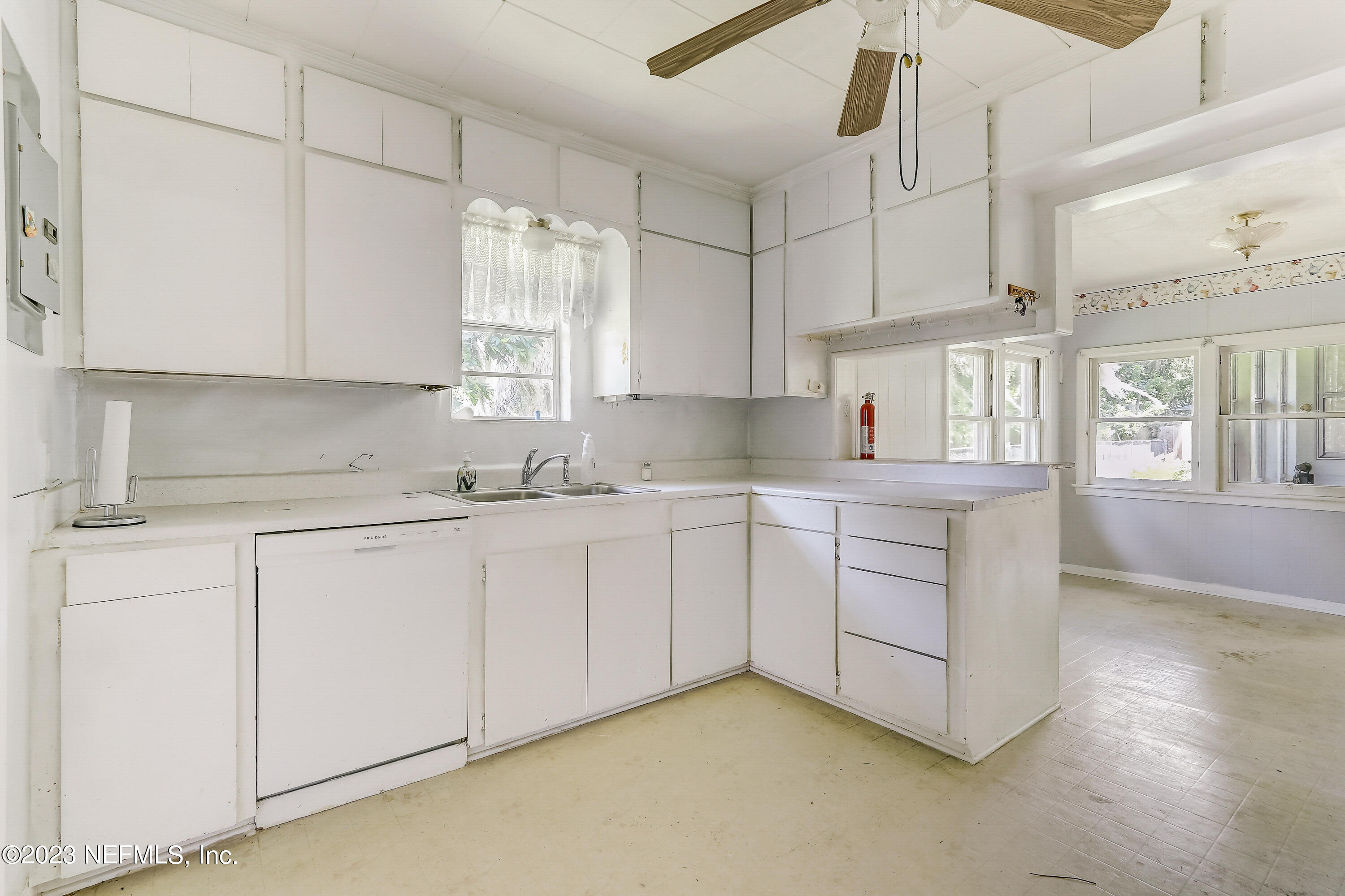 3547 Capper Road Jacksonville, FL 32218 - Photo 10 of 24 a kitchen with cabinets appliances a sink and a window