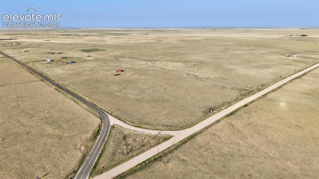 9670 Boone Road Yoder, CO 80864 - Photo 1 of 18 Expansive open land with a clear horizon, featuring two intersecting roads