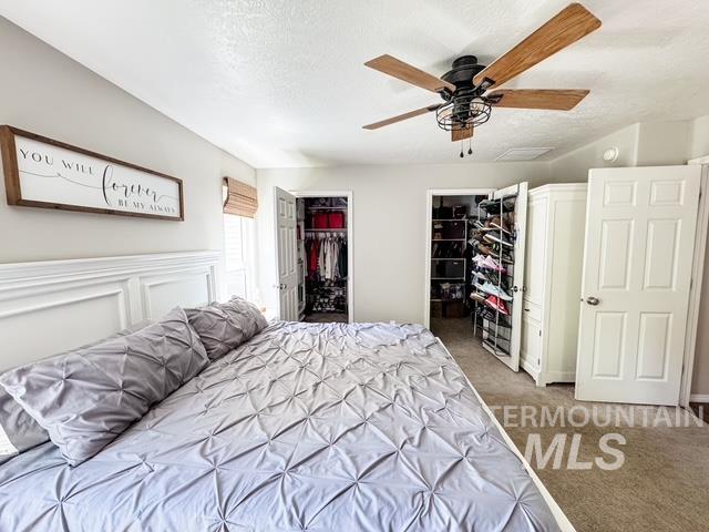 808 O'Leary Way Twin Falls, ID 83301 - Photo 21 of 37 Spacious room featuring a white paneled headboard and light-colored walls