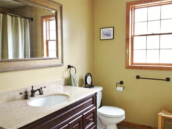 43 Old Poor Farm Road Ware, MA 01082 - Photo 11 of 29 a bathroom with a granite countertop toilet sink and mirror