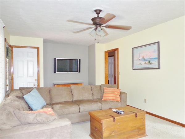 43 Old Poor Farm Road Ware, MA 01082 - Photo 15 of 29 a living room with furniture and a ceiling fan